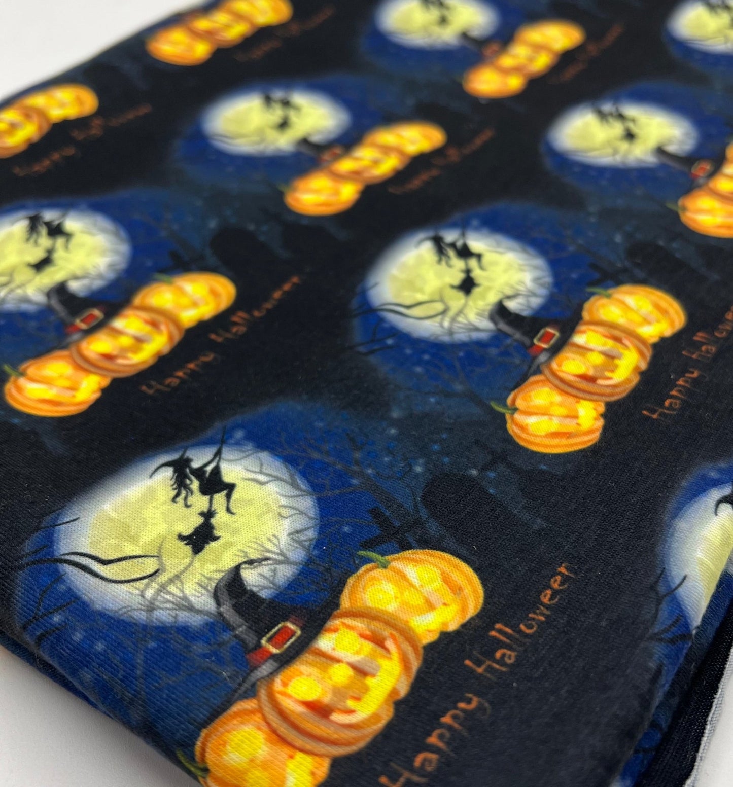 Blue Pumpkin Witch Print Spun Poly Stretch Fabric - T9 Fabrics