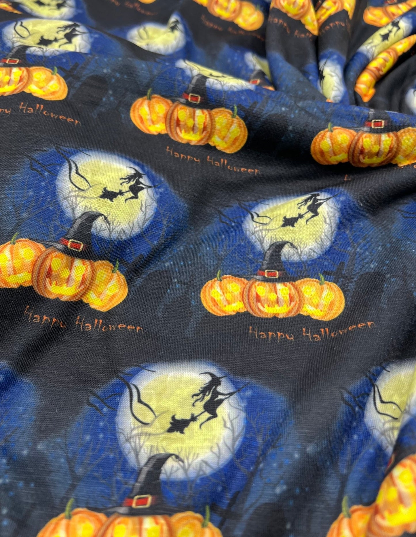 Blue Pumpkin Witch Print Spun Poly Stretch Fabric - T9 Fabrics