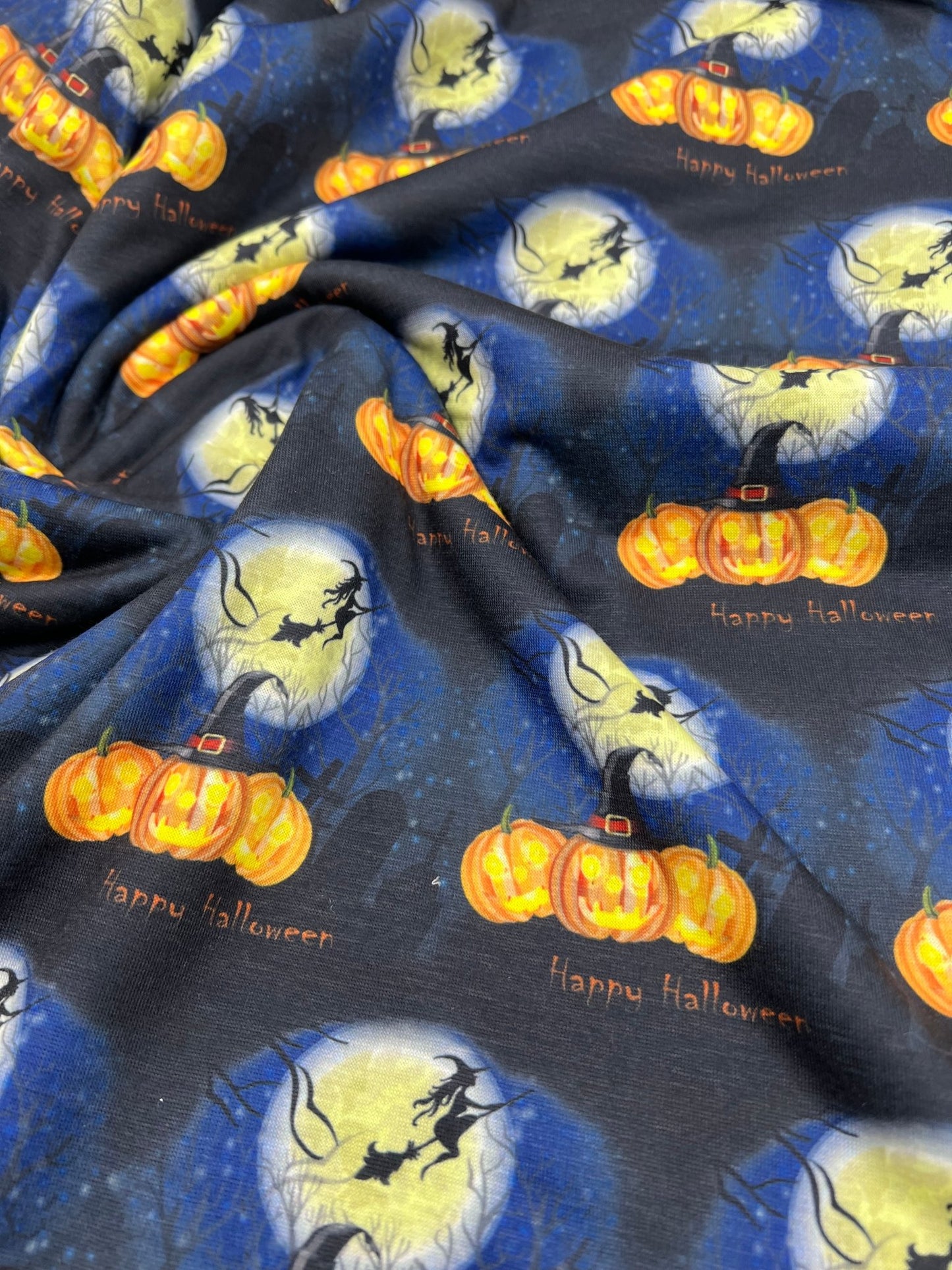 Blue Pumpkin Witch Print Spun Poly Stretch Fabric - T9 Fabrics