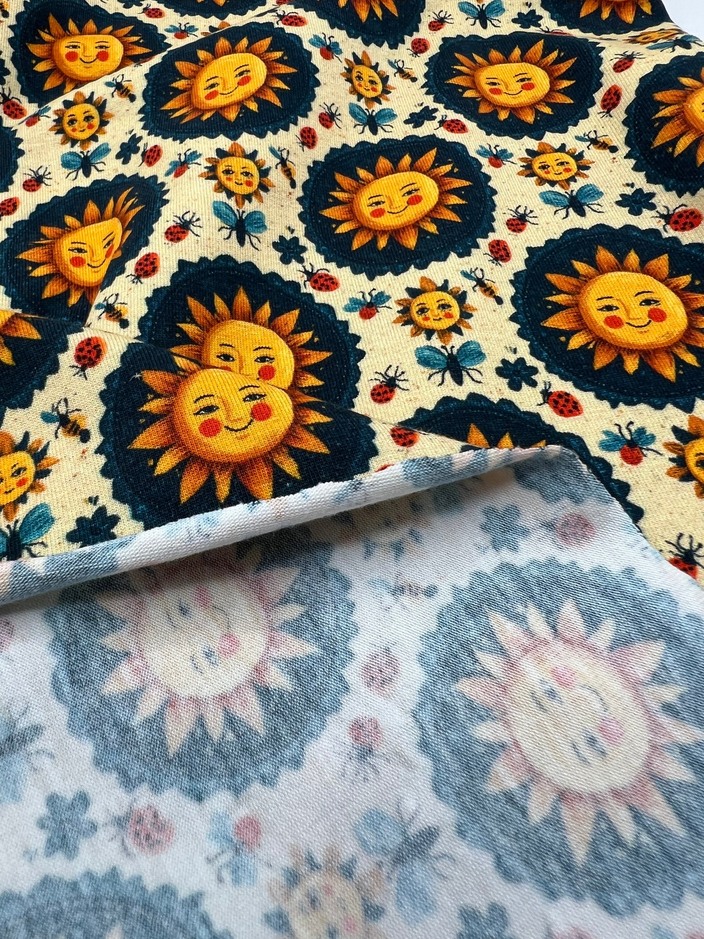 Folk Art Sun Faces Print Cotton Stretch Jersey 200 GSM 95/5 Lycra 4 Way Stretch