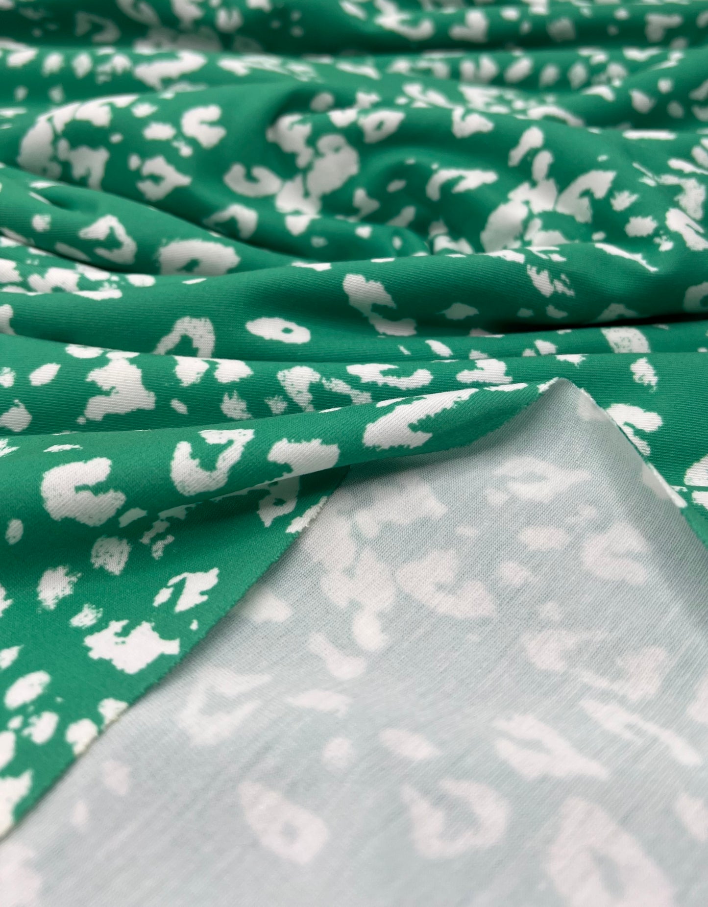 Green White Animal Mix Print Spun Poly Stretch Fabric