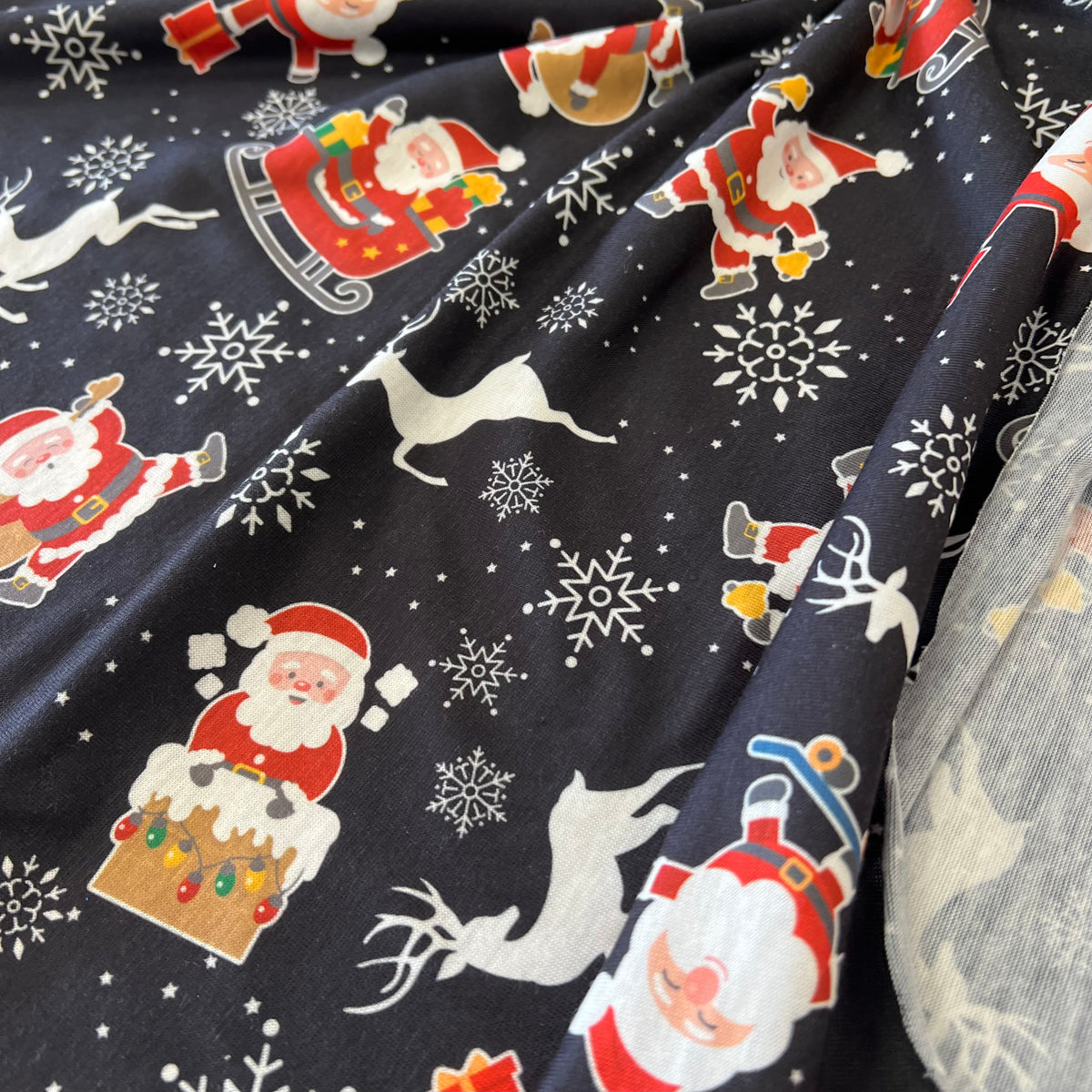 Santa Snowflake Print Soft Spun Poly Stretch Fabric