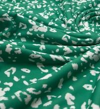Green White Animal Mix Print Spun Poly Stretch Fabric