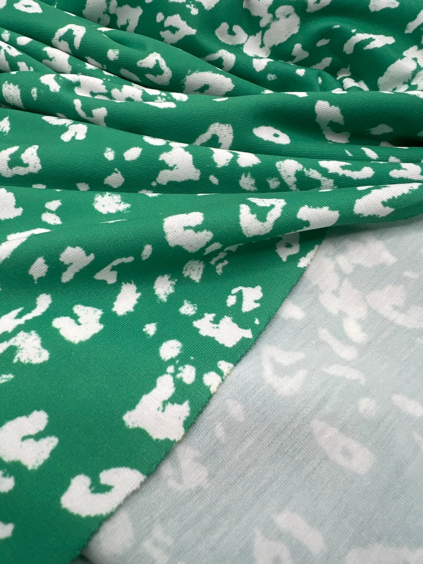 Green White Animal Mix Print Spun Poly Stretch Fabric