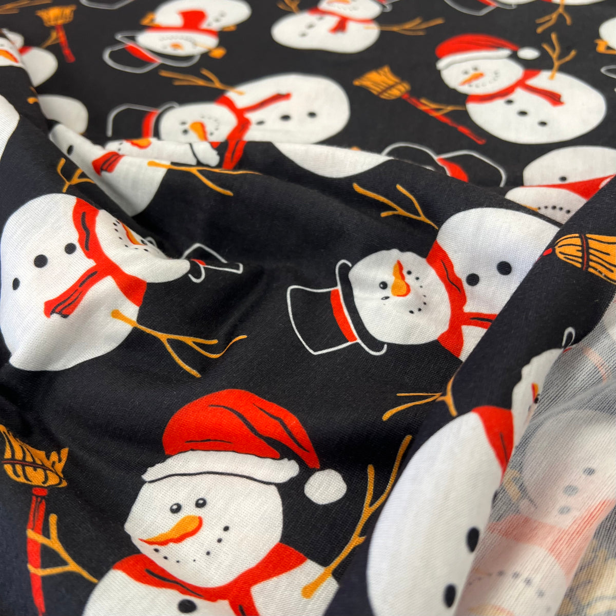 Snowman Broom Print Soft Spun Poly Stretch Fabric