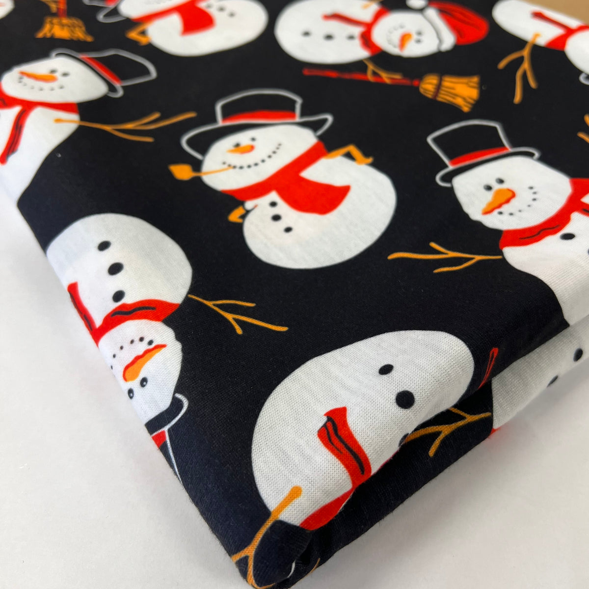 Snowman Broom Print Soft Spun Poly Stretch Fabric