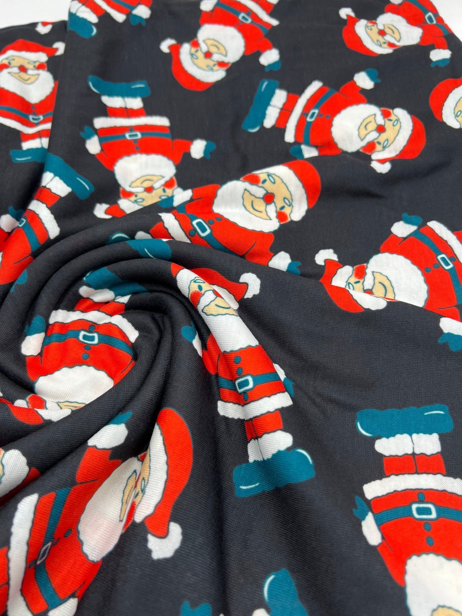 Black Rosy Cheek Santa Print Soft Spun Poly Stretch Fabric - T9 Fabrics