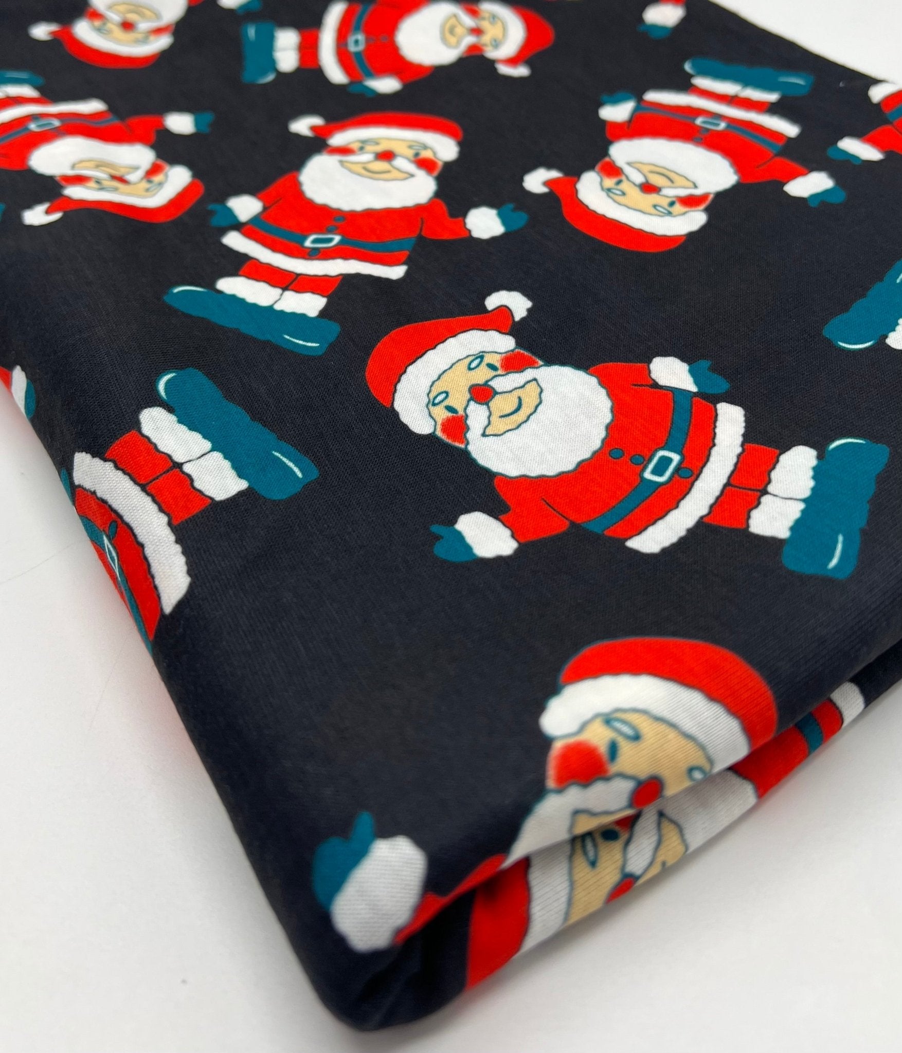Black Rosy Cheek Santa Print Soft Spun Poly Stretch Fabric - T9 Fabrics