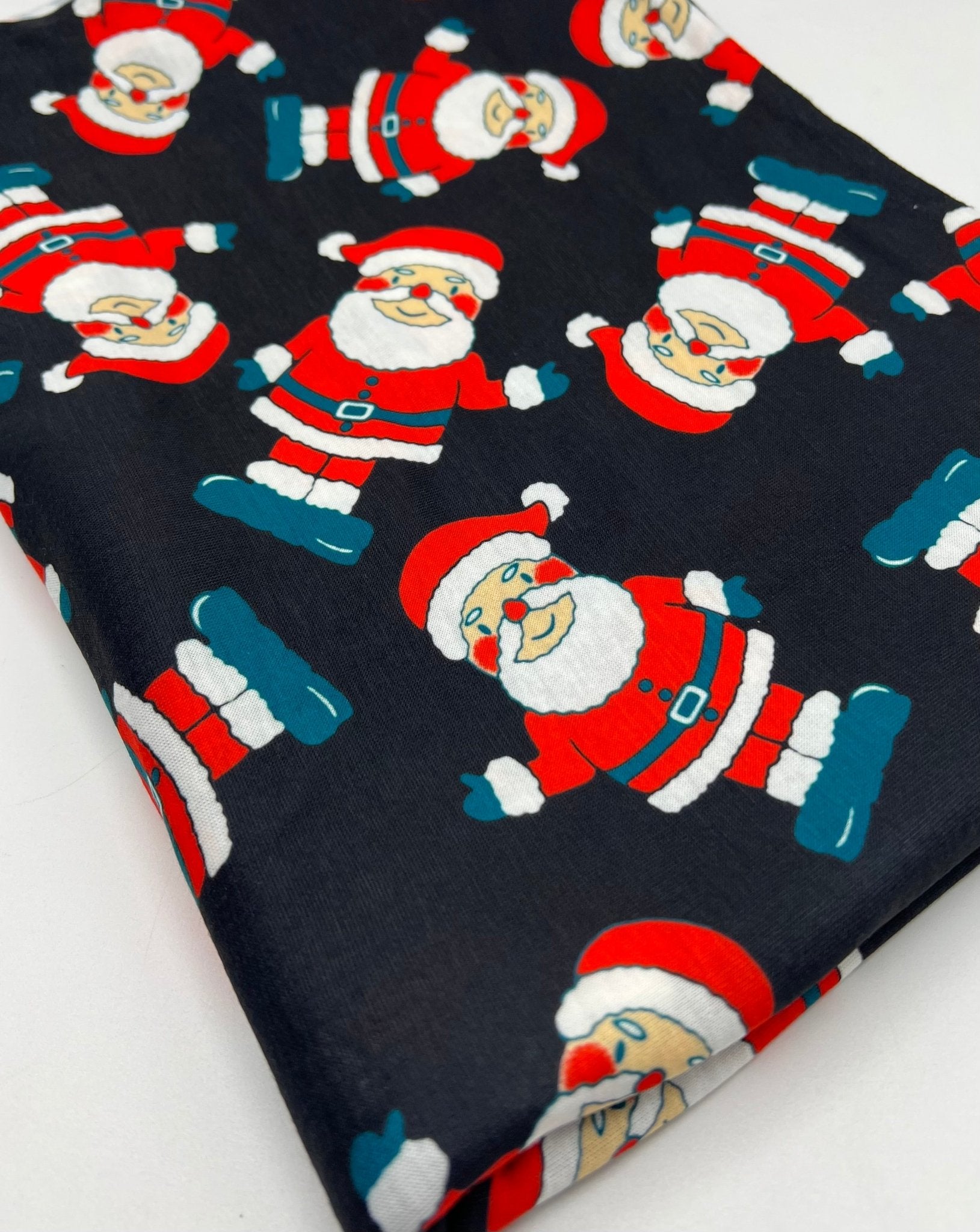 Black Rosy Cheek Santa Print Soft Spun Poly Stretch Fabric - T9 Fabrics