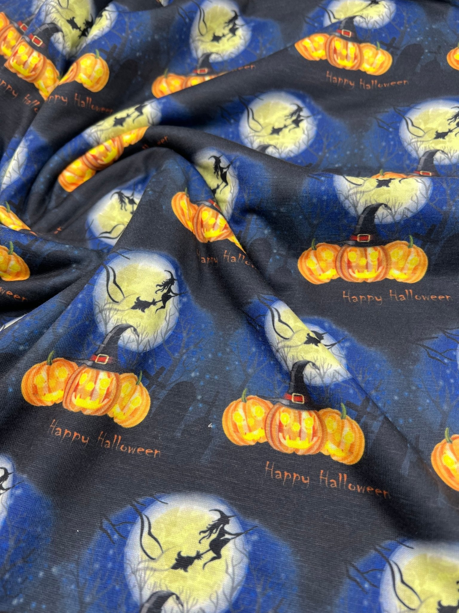 Blue Pumpkin Witch Print Spun Poly Stretch Fabric - T9 Fabrics