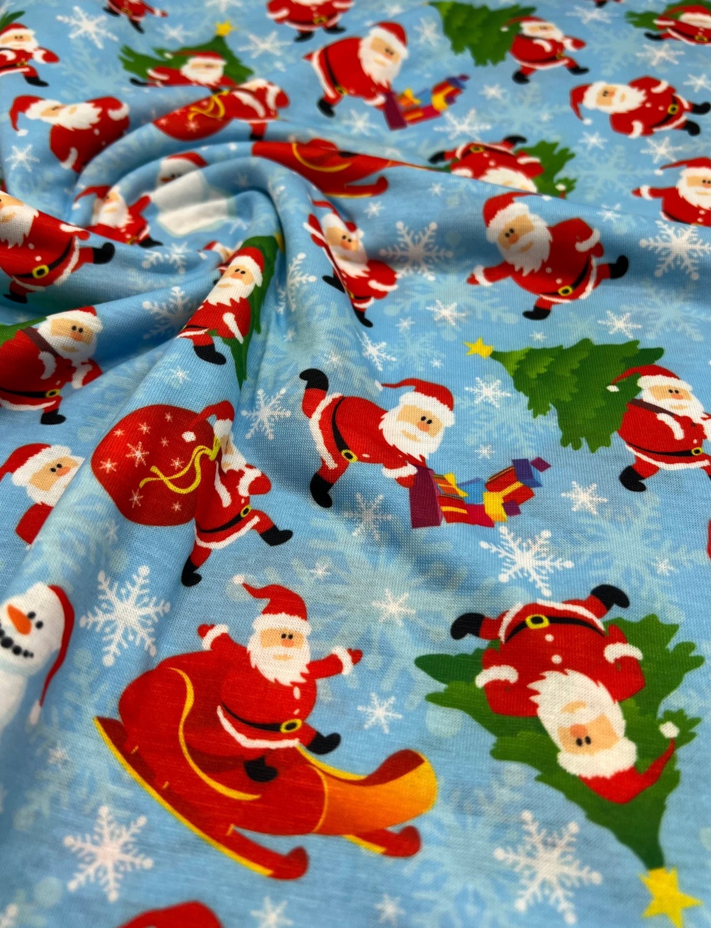 Blue Santa Sledge Print Soft Spun Poly Stretch Fabric - T9 Fabrics