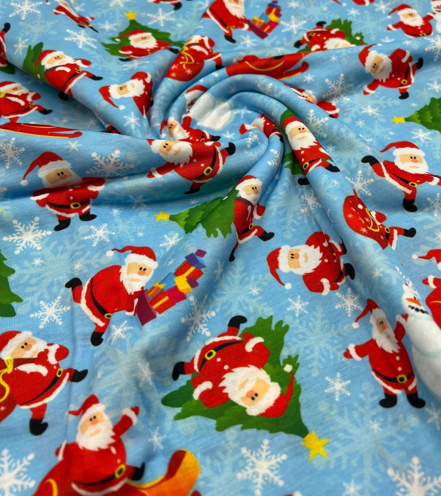 Blue Santa Sledge Print Soft Spun Poly Stretch Fabric - T9 Fabrics