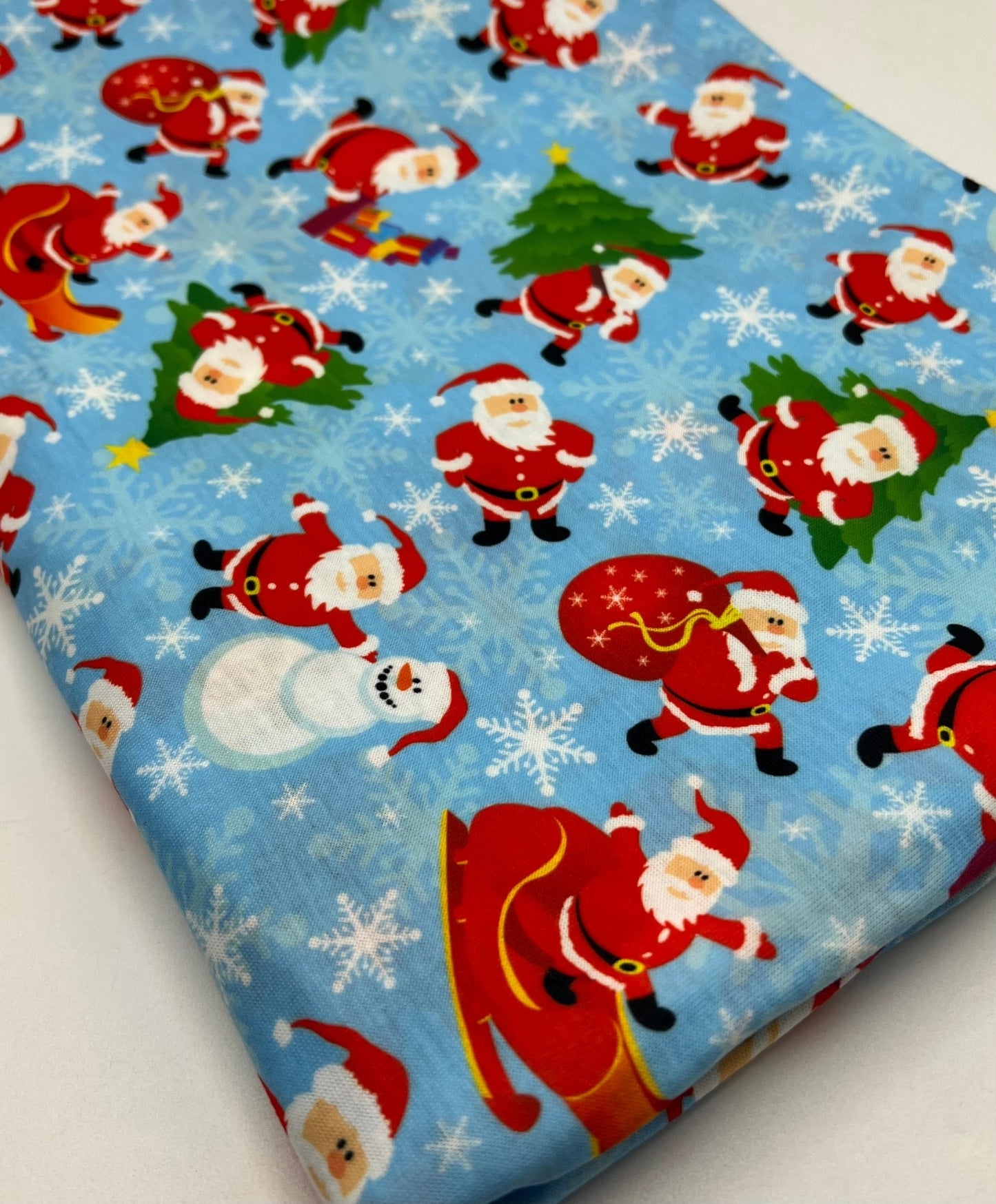 Blue Santa Sledge Print Soft Spun Poly Stretch Fabric - T9 Fabrics