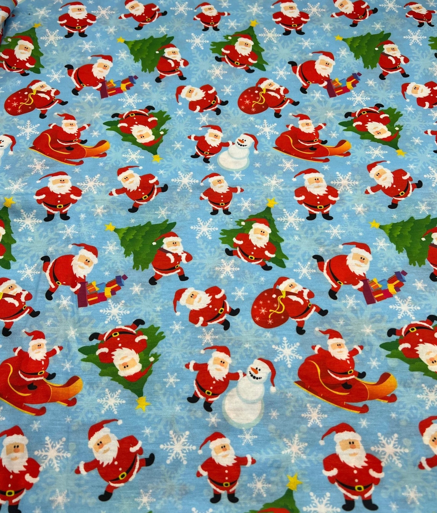 Blue Santa Sledge Print Soft Spun Poly Stretch Fabric - T9 Fabrics