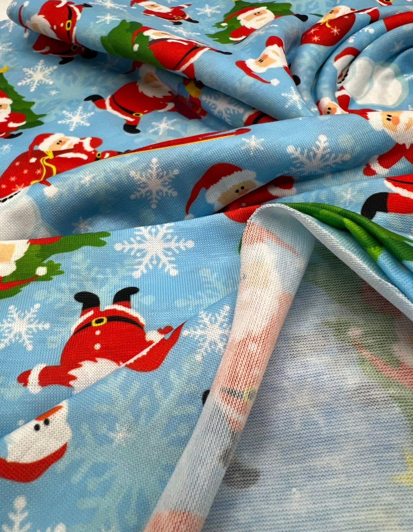 Blue Santa Sledge Print Soft Spun Poly Stretch Fabric - T9 Fabrics