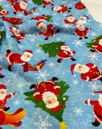 Blue Santa Sledge Print Soft Spun Poly Stretch Fabric - T9 Fabrics