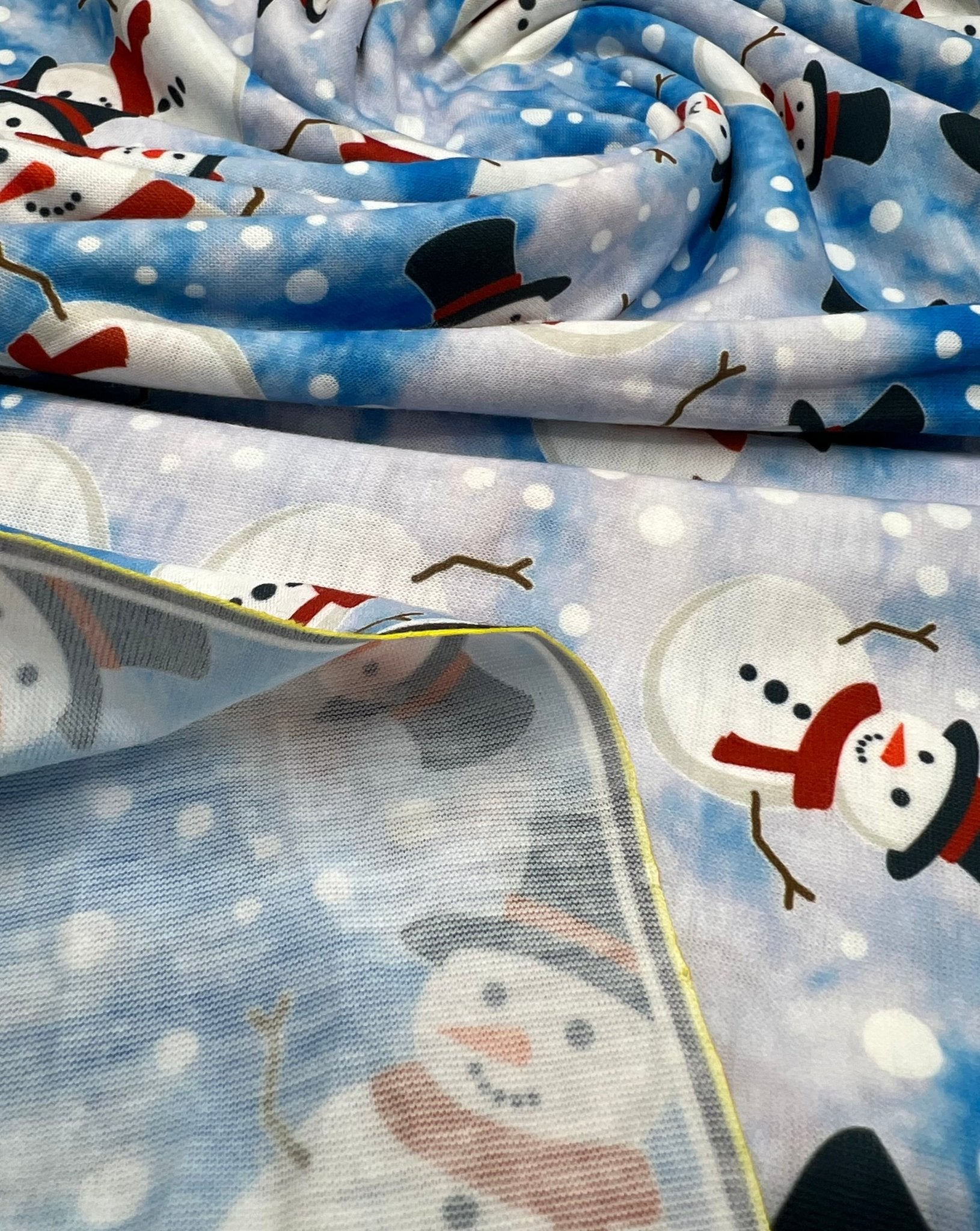 Blue Snow Snowman Print Soft Spun Poly Stretch Fabric - T9 Fabrics