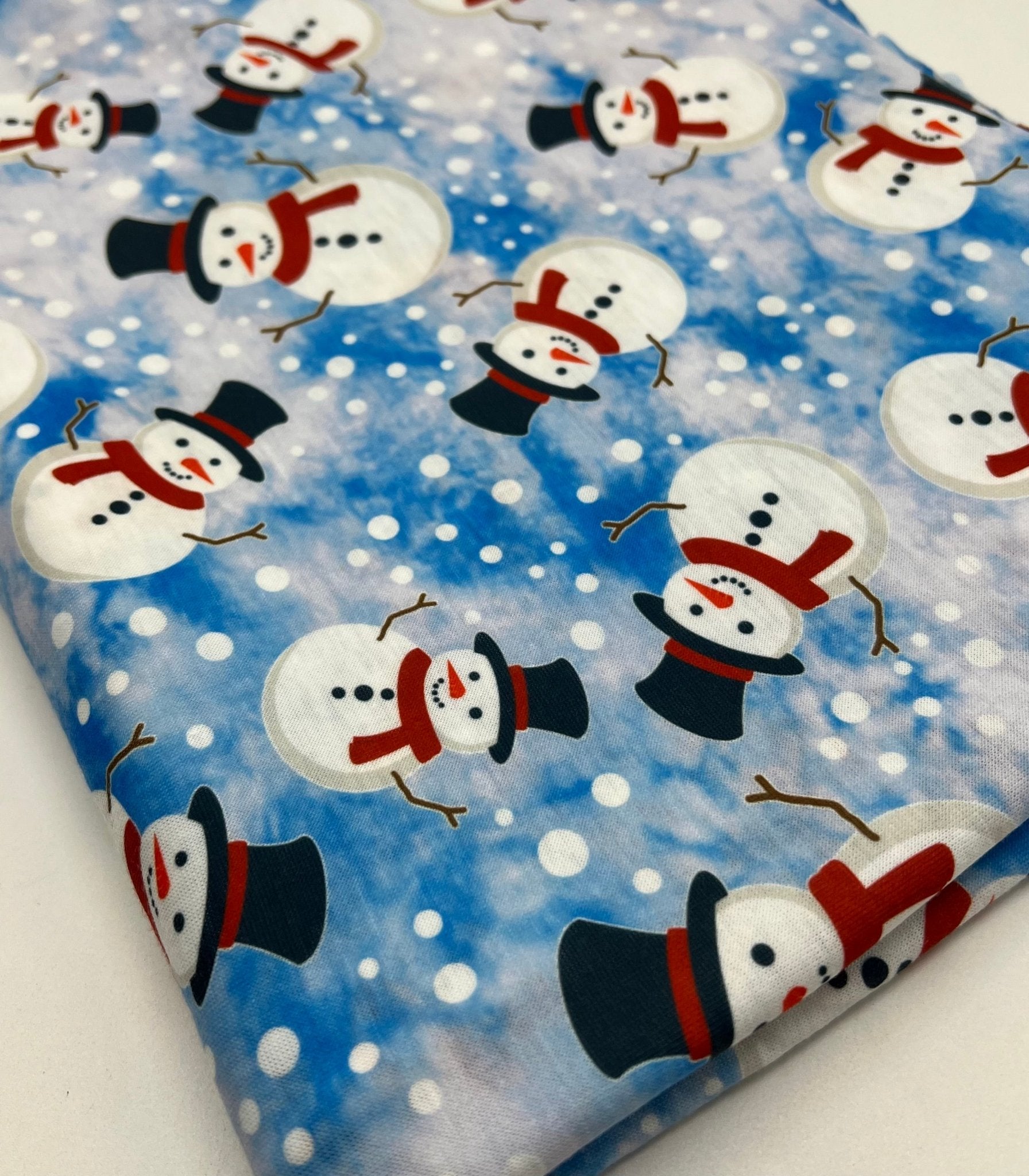 Blue Snow Snowman Print Soft Spun Poly Stretch Fabric - T9 Fabrics