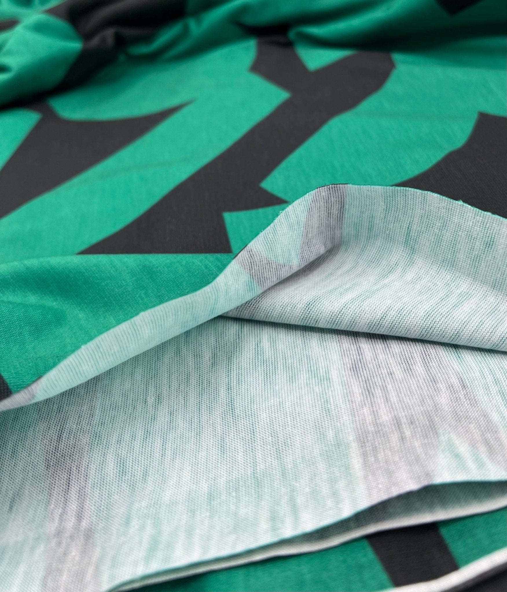 Green Black Spun Poly Stretch Fabric - T9 Fabrics