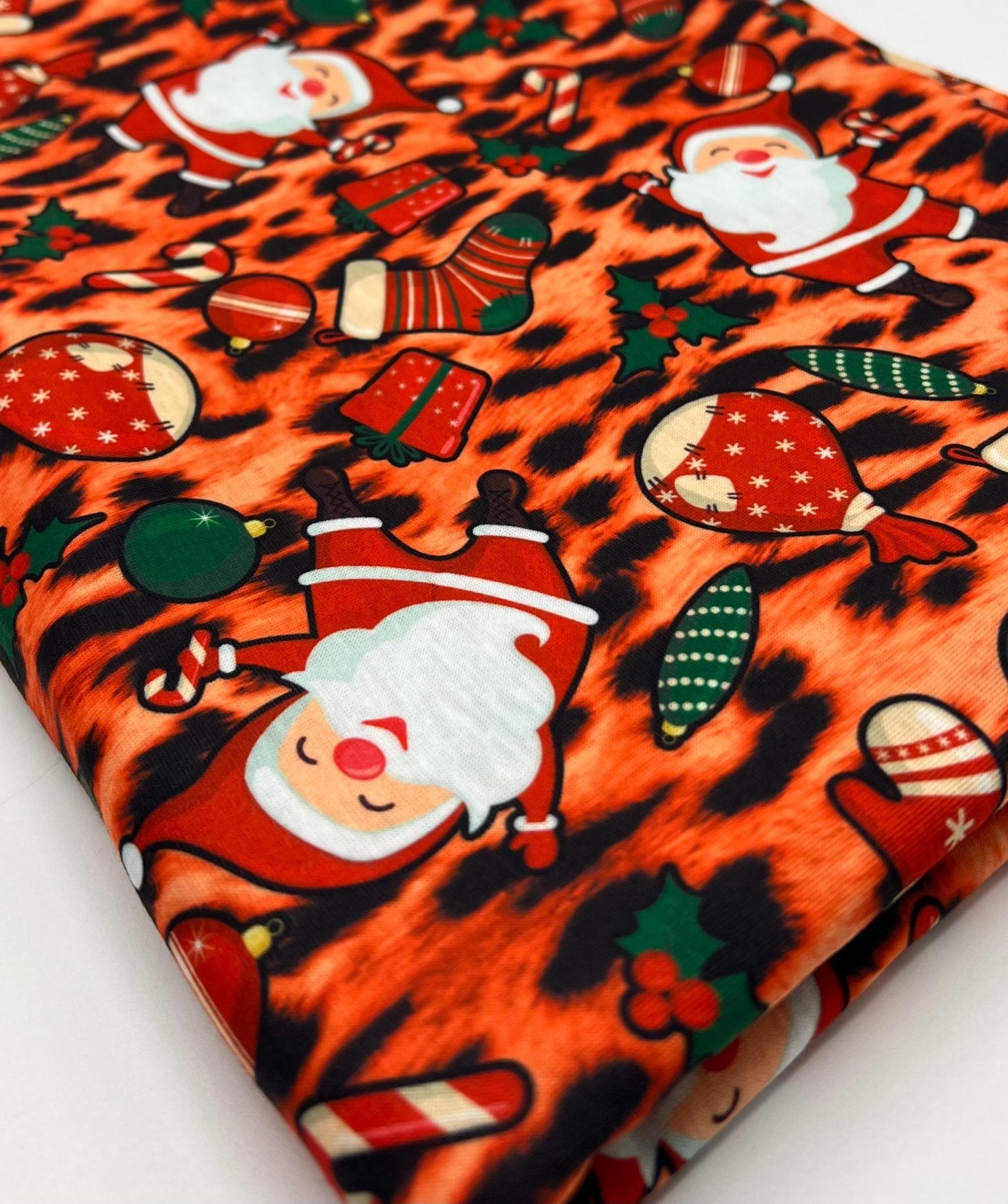 Orange Animal Santa Print Soft Spun Poly Stretch Fabric - T9 Fabrics