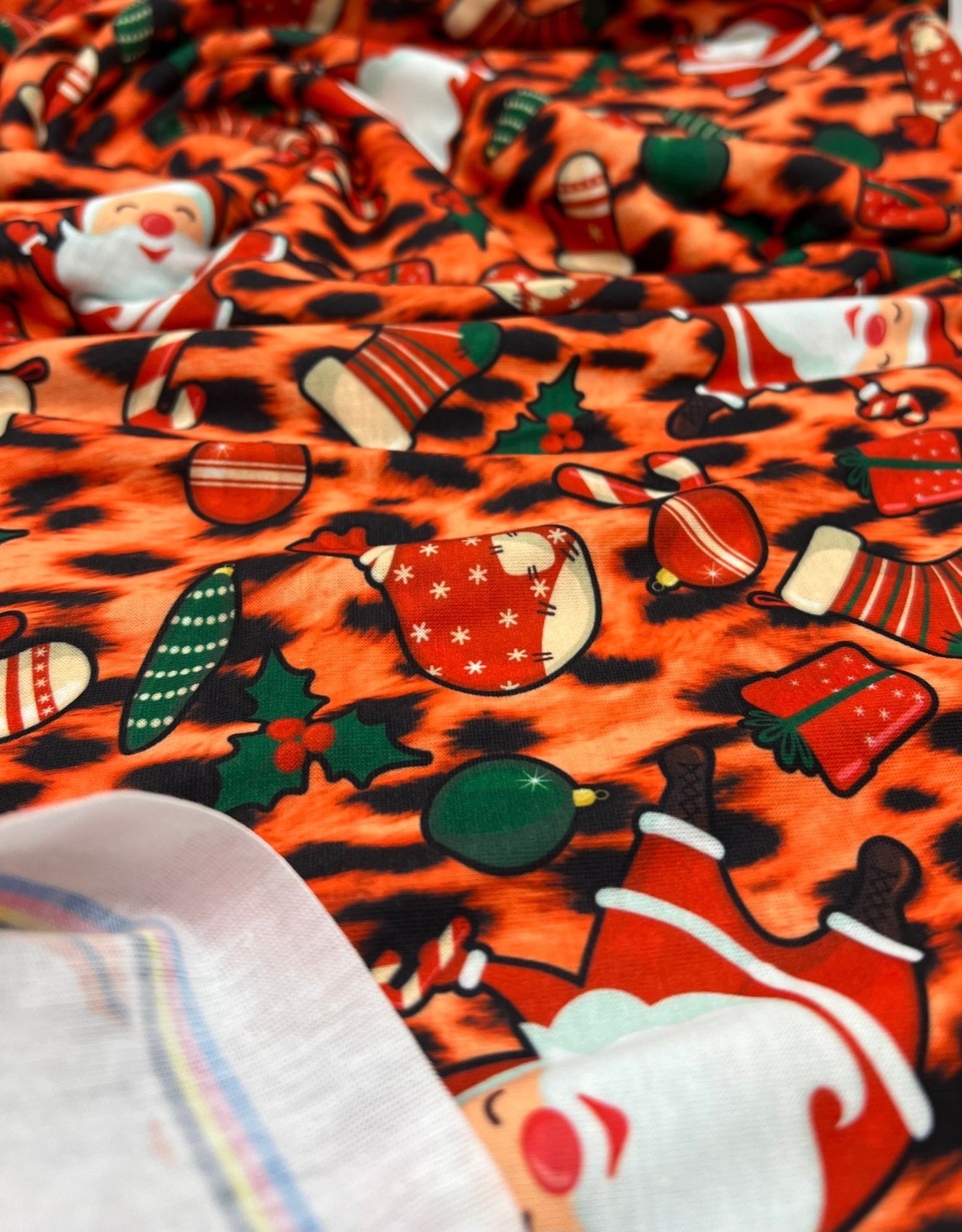 Orange Animal Santa Print Soft Spun Poly Stretch Fabric - T9 Fabrics