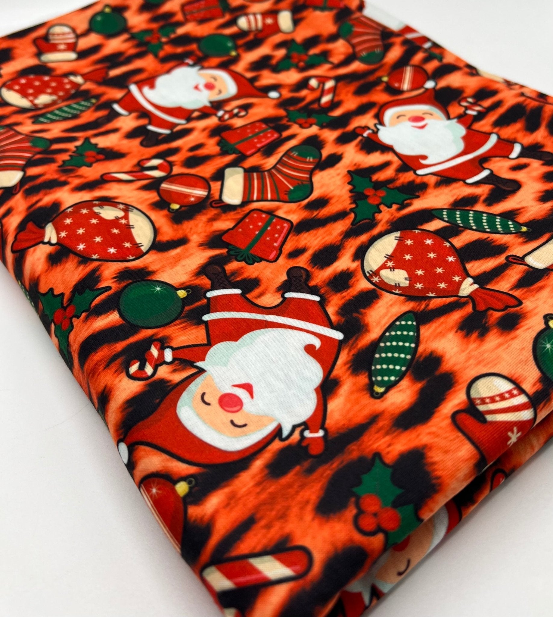 Orange Animal Santa Print Soft Spun Poly Stretch Fabric - T9 Fabrics