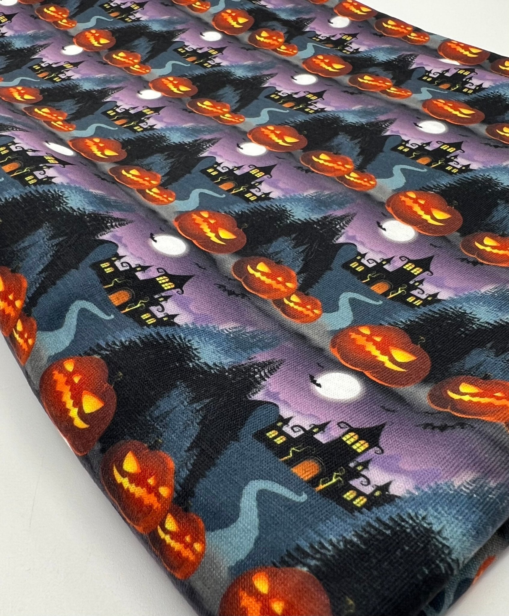 Purple Pumpkin Castle Print Spun Poly Stretch Fabric - T9 Fabrics