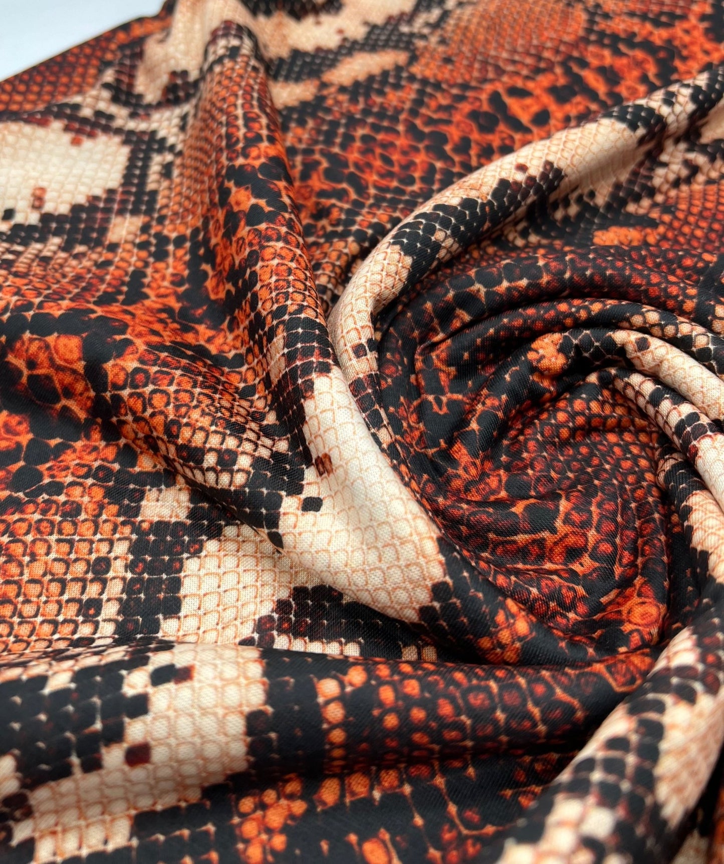 Rust Snake Print Spun Poly Stretch Fabric - T9 Fabrics